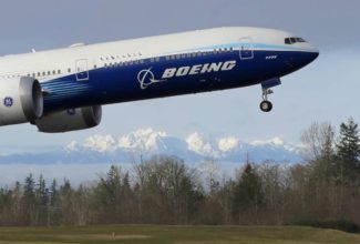 Boeing takes rare annual loss over grounded 737 Max jet