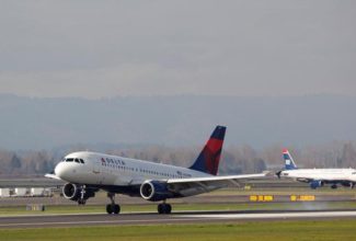 Icy Conditions Cause Delta Plane to Slide Off Taxiway