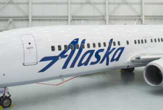 Alaska Airlines begins workforce cuts, sets oneworld date