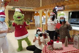 The Grinch Joins Carnival Fans to Deliver Holiday Cards to Crew Members