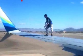 Man Disrupts Plane, Climbs Onto Wing Before Takeoff