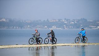 Tourists flock to Italy’s Lake Garda island after hidden path is revealed by drought