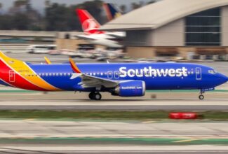 Passengers evacuate a Southwest 737 MAX following engine failure