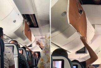 Passengers Attempt to Secure Loose Panel During Delta Air Lines Flight to Atlanta